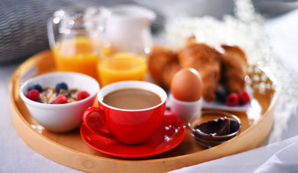 istock A tray with breakfast on a bed in a hotel room 1335697252