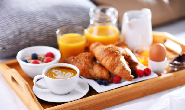 istock A tray with breakfast on a bed in a hotel room 1335697283