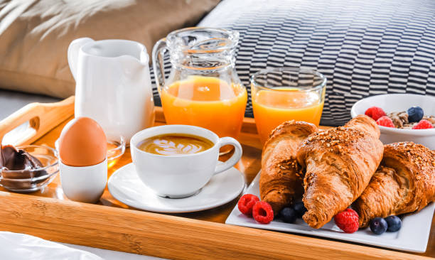 istock A tray with breakfast on a bed in a hotel room 1335697301
