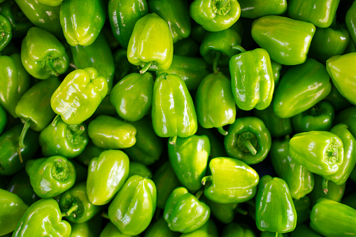 Top view of fresh sweet green bell peppers in public bazaar market. Can be use for food background, food concept