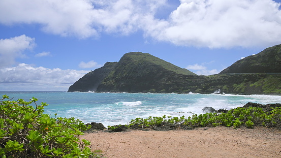 Beach with black lava rocks on Oahu, Hawaii