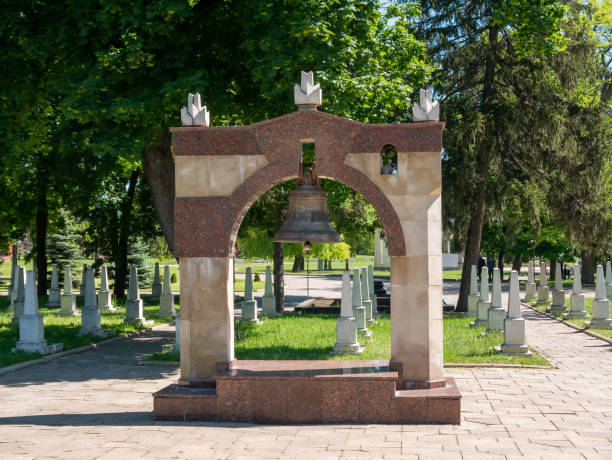 istock Memorial military complex. A large bell in a Christian cemetery. 1335699283