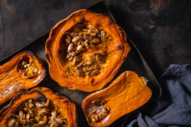 istock Pumpkin and butternut squash roasted oven on dark wooden background 1335700808