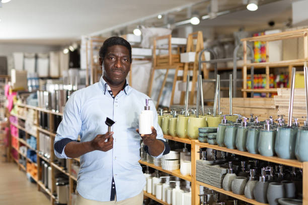istock Interested african american man choosing bathroom accessories in store 1335701286
