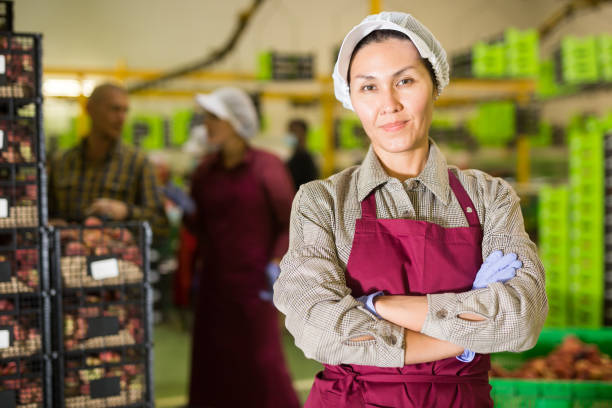istock Asian female worker at warehouse 1335704028