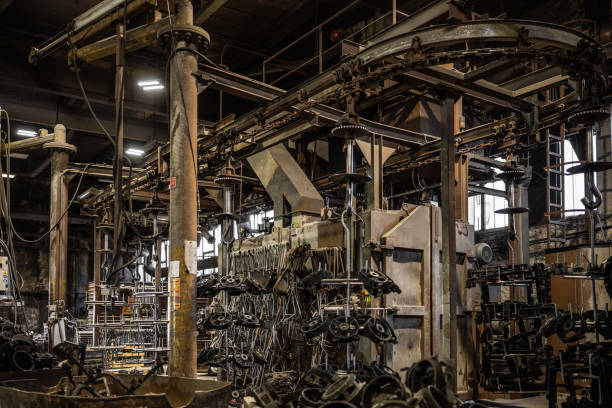 istock Interior in old industrial plant, chain conveyor with products placed on holders 1335706519