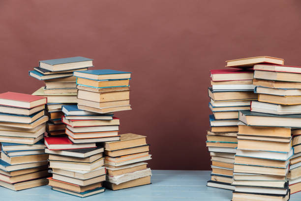 istock Stacks of books for teaching college library knowledge brown background 1335707583
