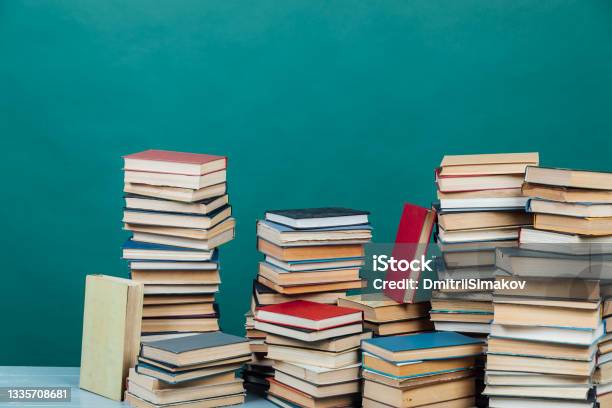 Stacks Of Books For Teaching Knowledge College Library Green Background Stock Photo - Download Image Now