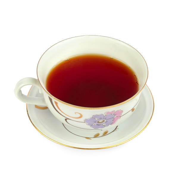 istock Tea in a vintage porcelain cup isolated on white background. 1335708885