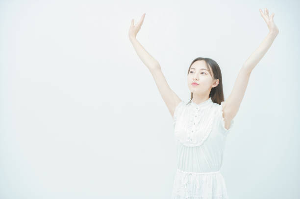istock Young woman taking a deep breath 1335710280