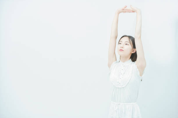 istock Young woman taking a deep breath 1335710876