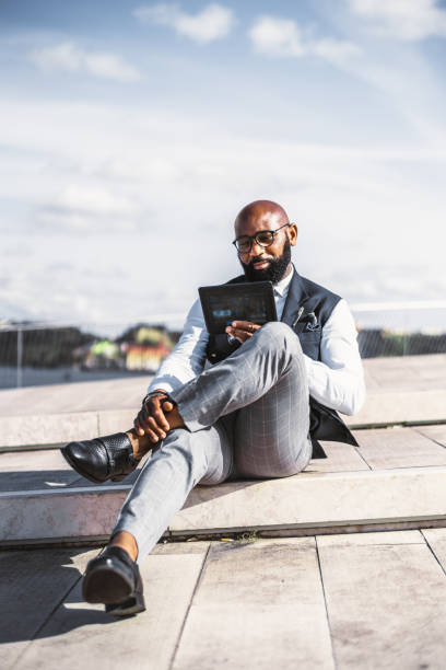 istock A black man entrepreneur with gadget 1335710883