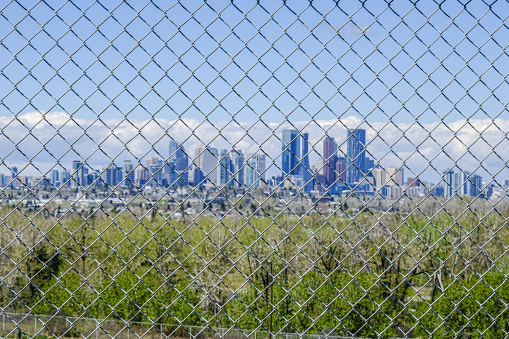Calgary City Skyline behind fence