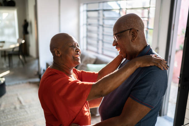 istock Senior couple dancing at home 1335712967