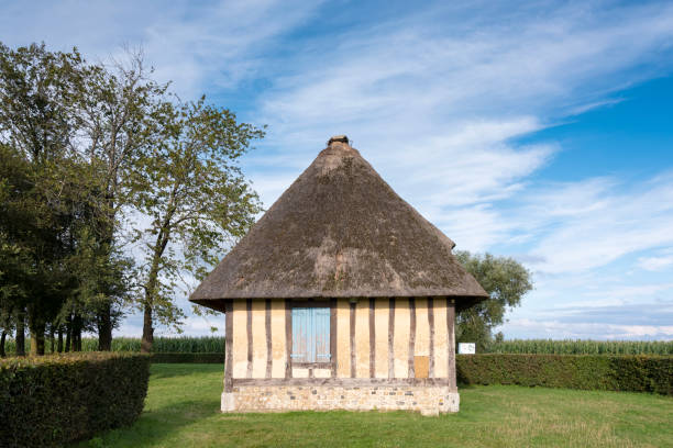 beautiful half timbered old farm in french normandy under blue summer sky