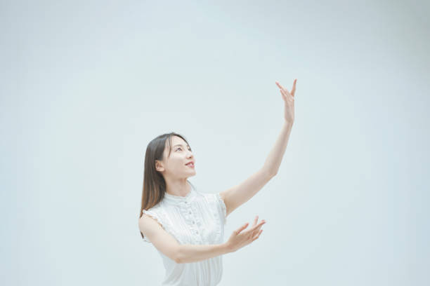 Asian young woman dancing gracefully
