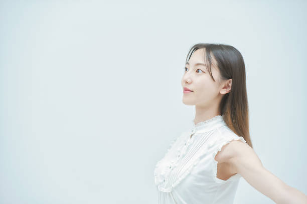 istock Asian young woman dancing gracefully 1335715114