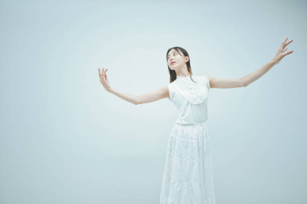 istock Asian young woman dancing gracefully 1335715204