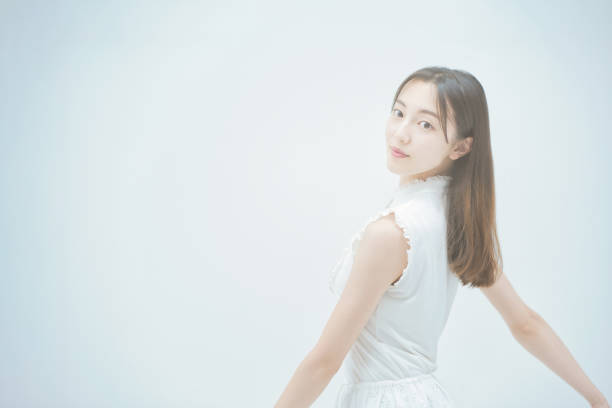 istock Asian young woman dancing gracefully 1335715333