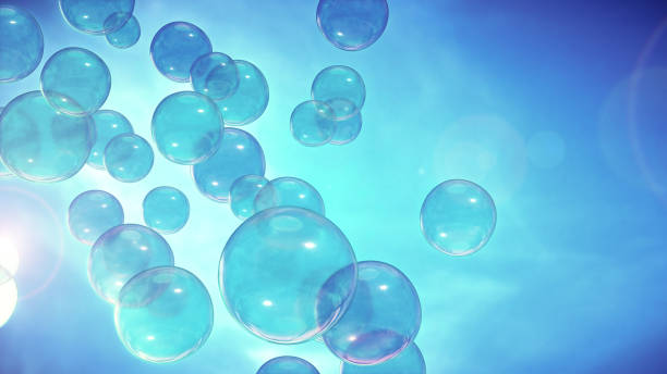 istock Close up on soap bubbles rising up on a shining blue sky. 1335720811