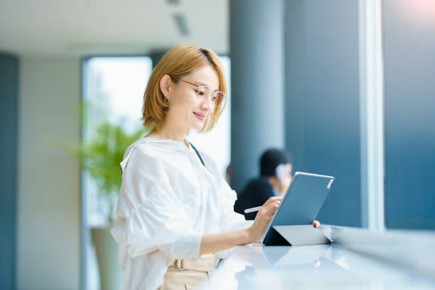 A woman operating a tablet PC in the city