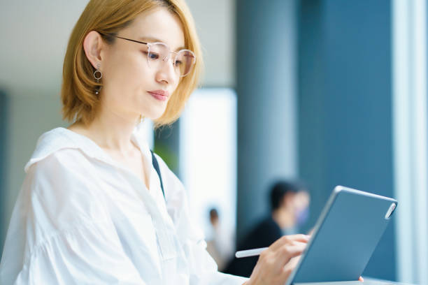 istock A woman operating a tablet PC in the city 1335720969