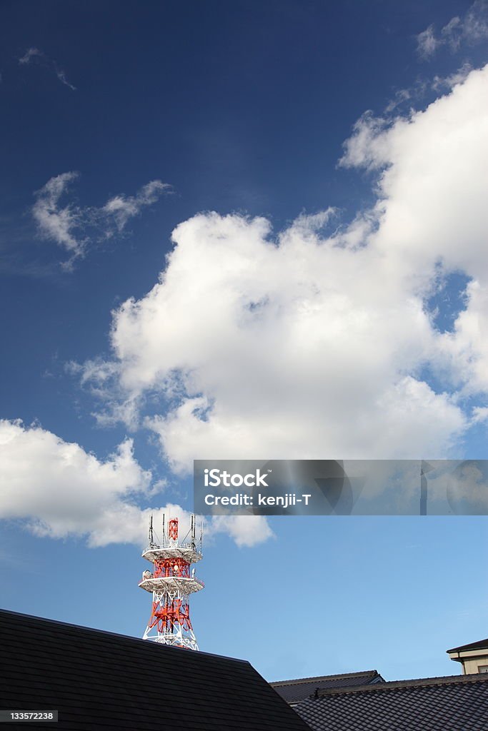 Tower, roof, sky and clouds There are red and white tower across the roof of the building, it was beautiful blue sky in the background. Autumn Stock Photo