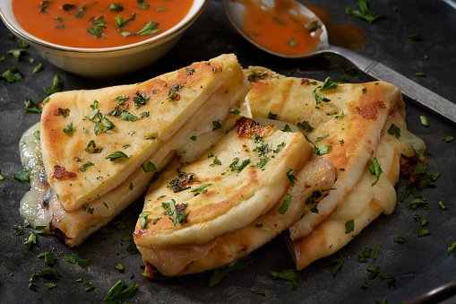 Garlic Naan Bread Grilled Cheese Drizzled with Tomato Soup