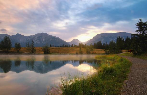 istock Summer Sunrise Glowing Over Quarry Lake 1335730508