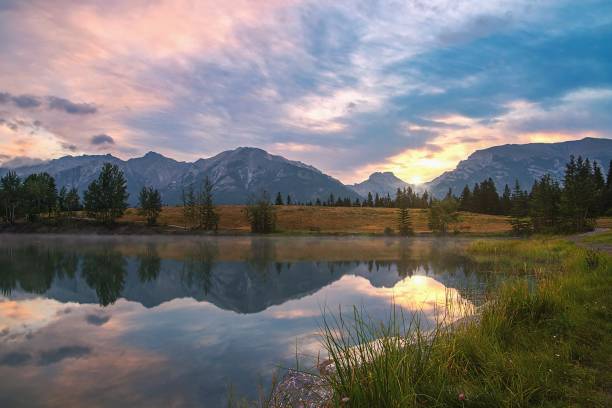 istock Summer Sunrise Glowing Over Quarry Lake 1335730538