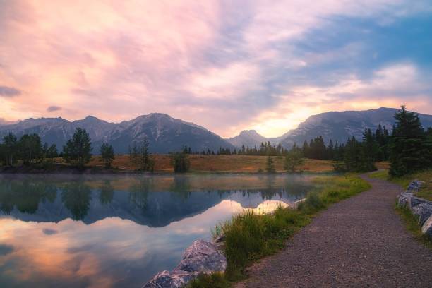 istock Summer Sunrise Over Quarry Lake And Mountains 1335730616