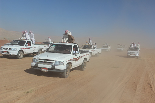 Serabit el Khadim, South Sinai Egypt - September 12 2020 Camel race people in cars following camels running
