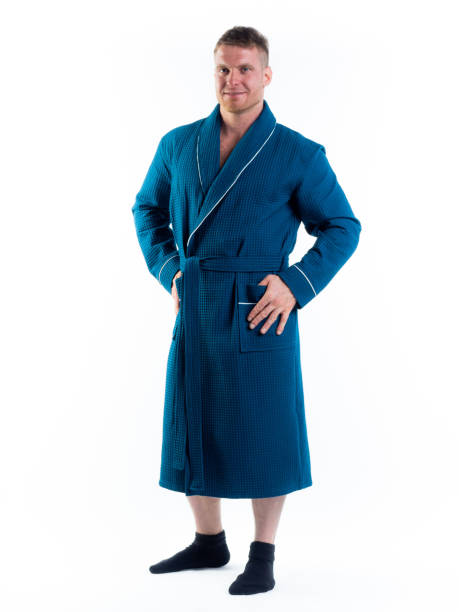 istock strong man in a Bathrobe on an isolated white background with a smile on his face. 1335770800