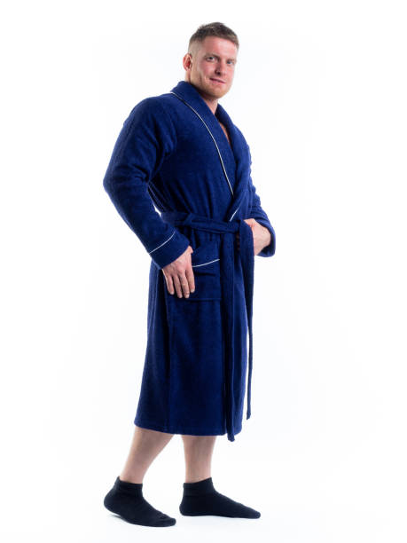 istock strong man in a Bathrobe on an isolated white background with a smile on his face. 1335770806