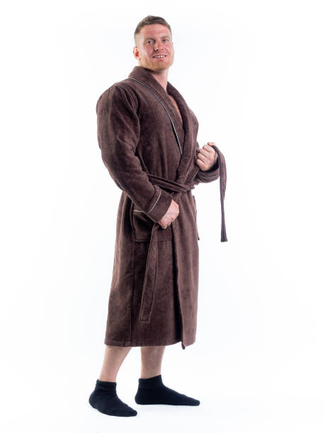 istock strong man in a Bathrobe on an isolated white background with a smile on his face. 1335770807