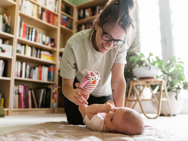 istock Young mother with baby at home 1335770866