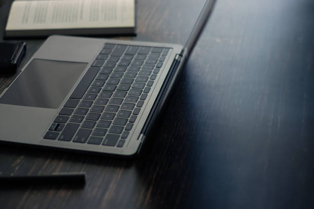 istock Concept of working or using laptop and studying or leaning book 1335773514