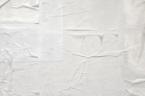 istock Blank white crumpled and creased paper poster texture 1335774460