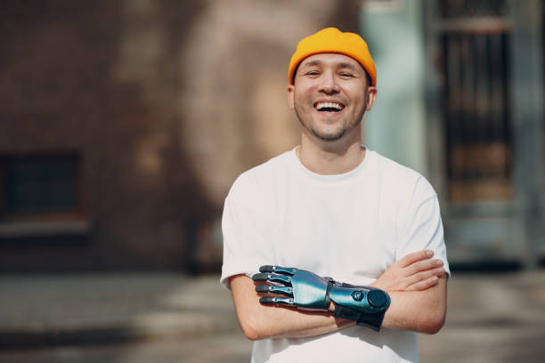 istock Young disabled man with artificial prosthetic hand in casual clothes. 1335774745