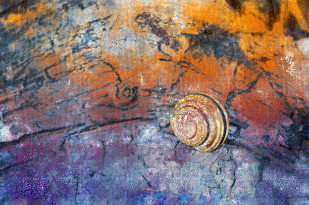 istock A snail crawling on a multicolored wooden surface. One mollusk o 1335775264