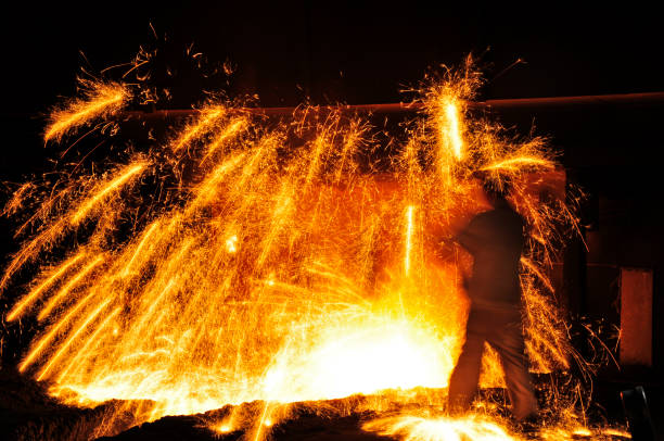 istock Smelting industry sparks in steel mills 1335776411