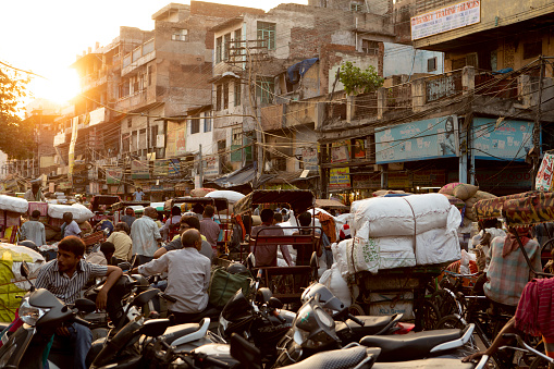 Delhi, India - August 22, 2018: Crowded streets of Chandni Chowk during sunset.