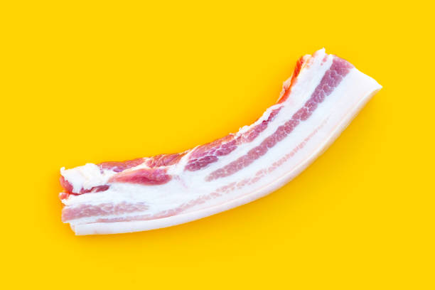 istock Streaky pork on yellow background. 1335779977