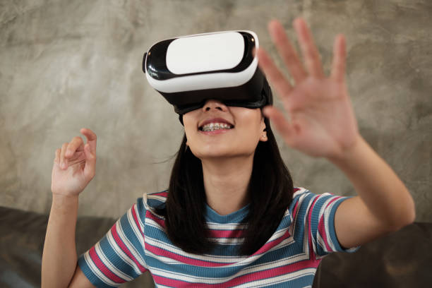 istock Asian woman with VR headset, watching the 3D virtual simulation. 1335792859