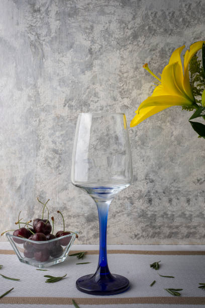 Glass cup with cherries and a minimalist and elegant background