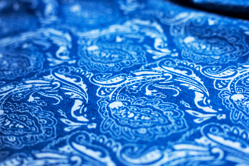 Low level view over blue and white pattern design  of textile