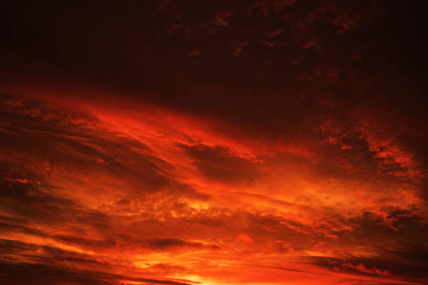 istock Red sky with clouds. Fiery red sunset background with copy space for design. 1335800628