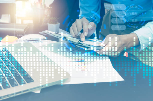 istock Businessman document paperwork graph and computer laptop. Business concept with technology theme hologram digital virtual screen interface. 1335801330