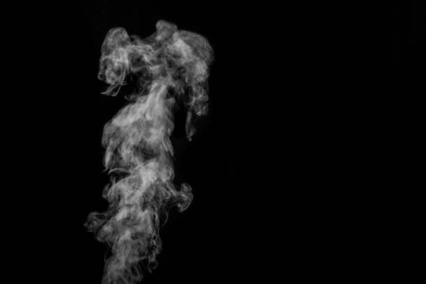 istock Perfect mystical curly white steam or smoke isolated on black background. Abstract background fog or smog 1335809099
