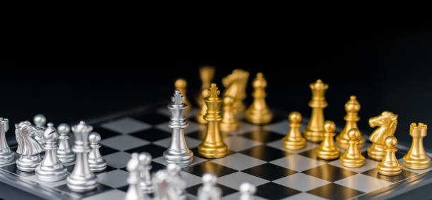 istock chess board game in competition play, Ideas business success concept 1335810734